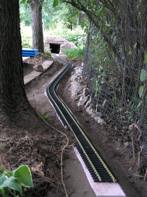 [Behind the train shed]
